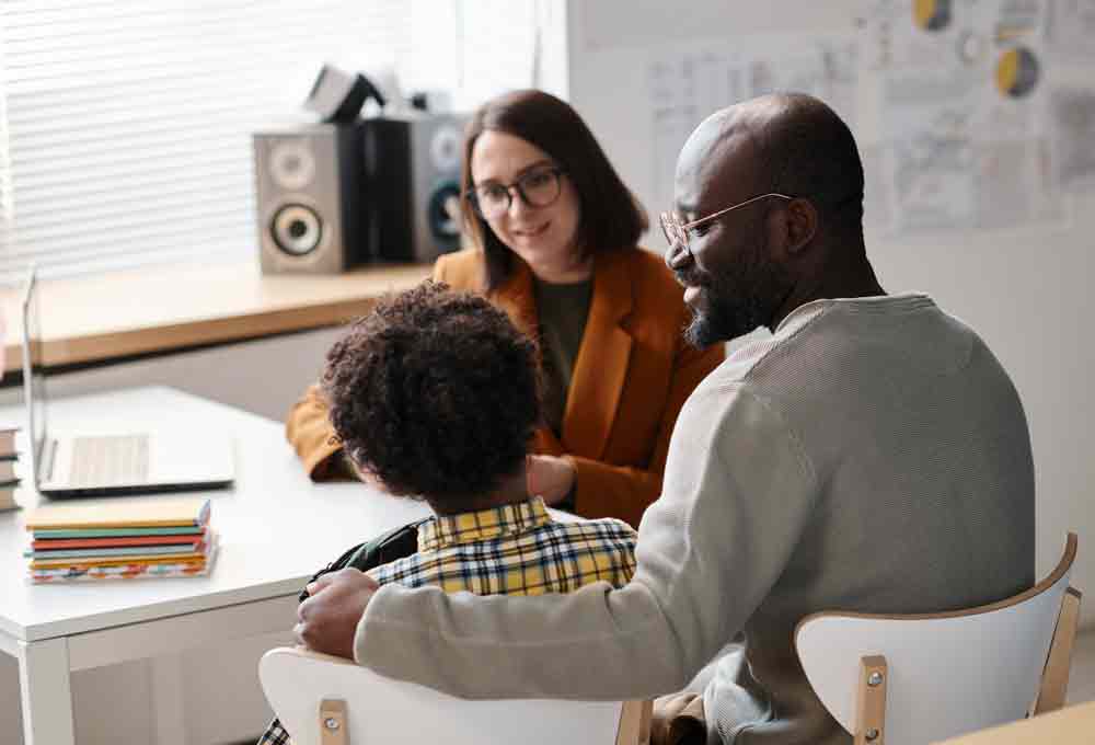 Parent and child sitting with therapist | Kaleidoscope Educational Diagnostics, LLC